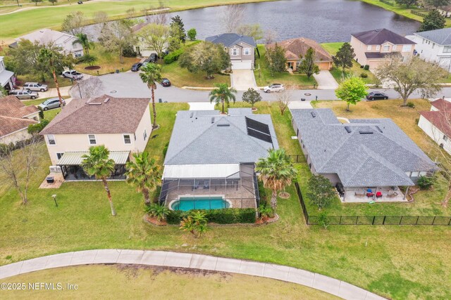 bird's eye view with a water view and a residential view