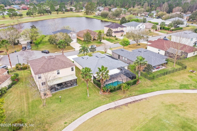 birds eye view of property featuring a residential view and a water view