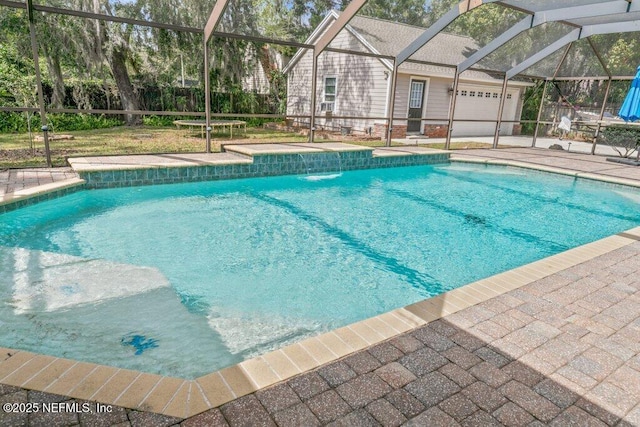 outdoor pool featuring a lanai, fence, and a patio