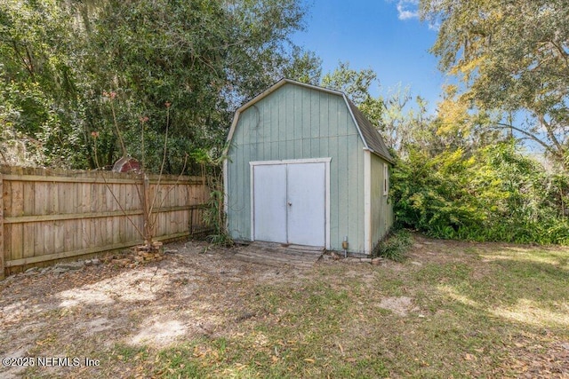 view of shed with fence