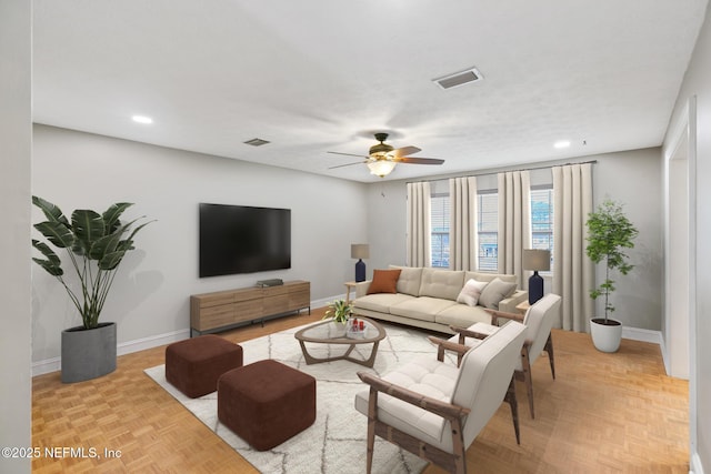 living area with baseboards, visible vents, a ceiling fan, and recessed lighting