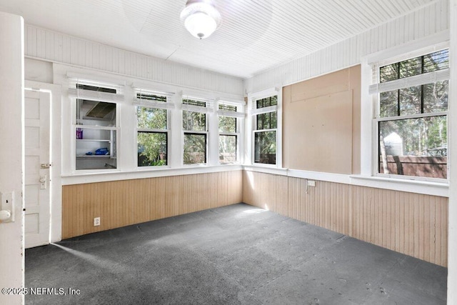 unfurnished sunroom with plenty of natural light