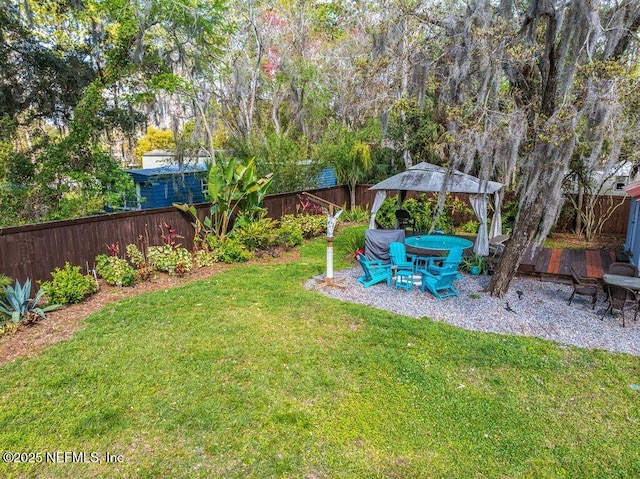 view of yard with a patio area, a fenced backyard, and a gazebo