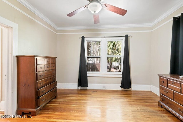 bedroom with ornamental molding, light wood-type flooring, ceiling fan, and baseboards