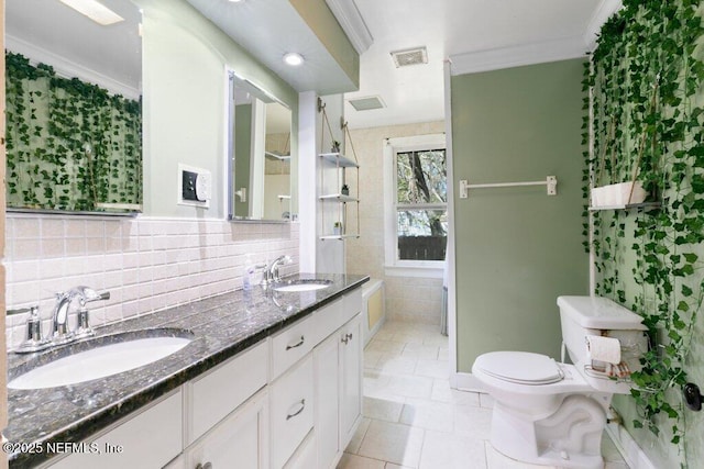 full bath featuring toilet, ornamental molding, a sink, and visible vents