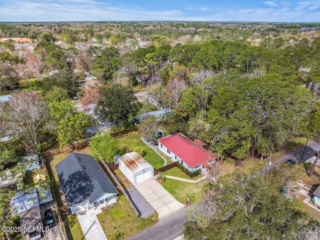 drone / aerial view featuring a view of trees