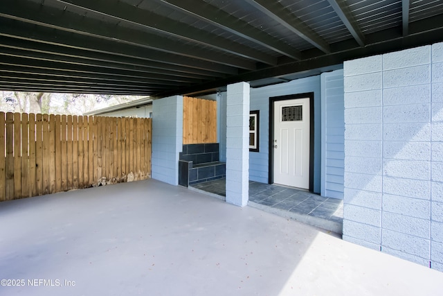 view of patio featuring fence