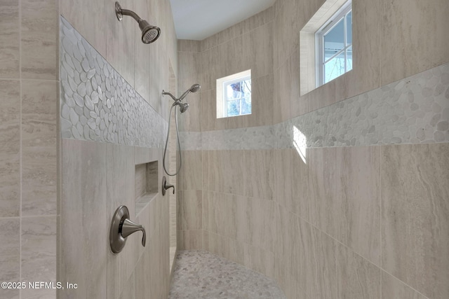 bathroom with a tile shower