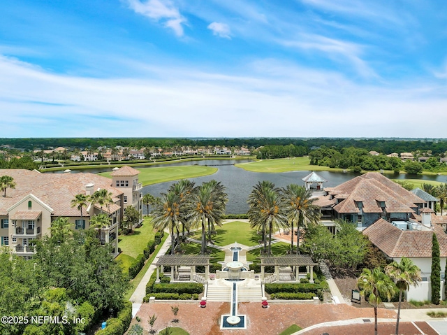 bird's eye view with a water view and view of golf course