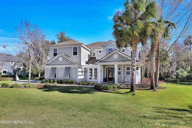 view of front facade with a front yard and fence