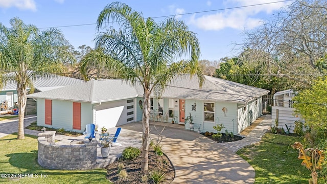 view of front of house with a garage and driveway