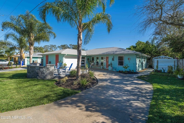 single story home with an attached garage, driveway, and a front lawn