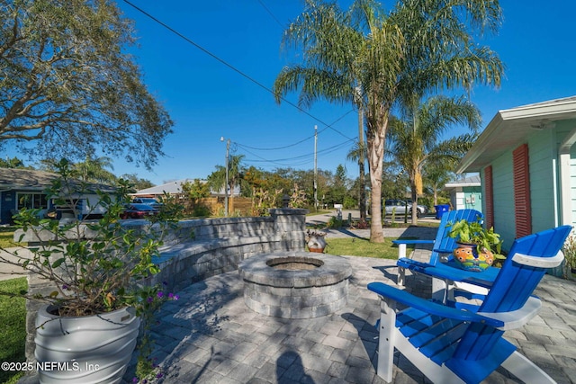 view of patio with a fire pit