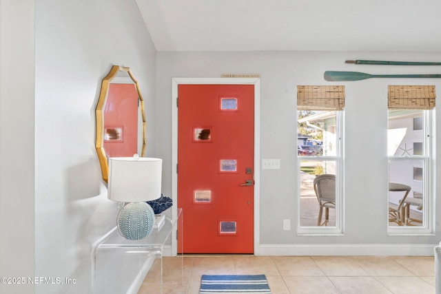 entryway featuring tile patterned flooring and baseboards