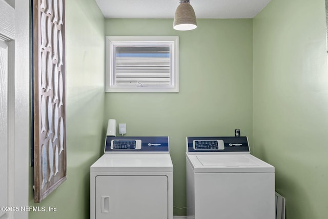 laundry area with laundry area and independent washer and dryer