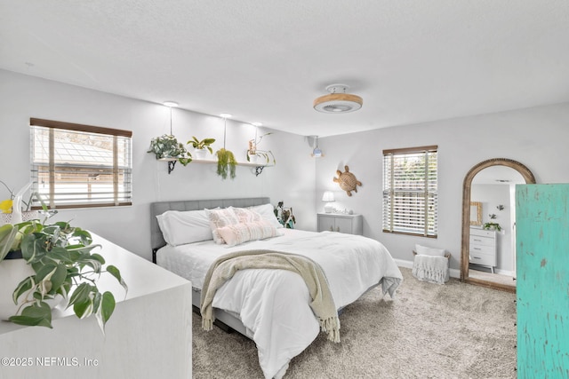 bedroom with carpet and baseboards