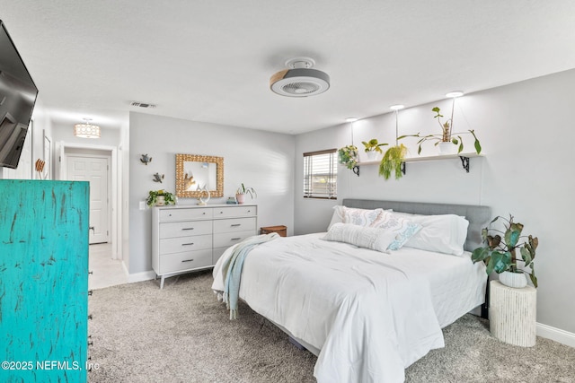 bedroom with baseboards, visible vents, and carpet flooring