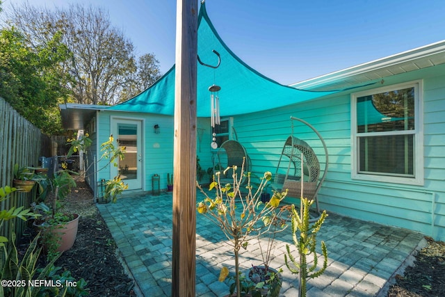 view of patio featuring fence