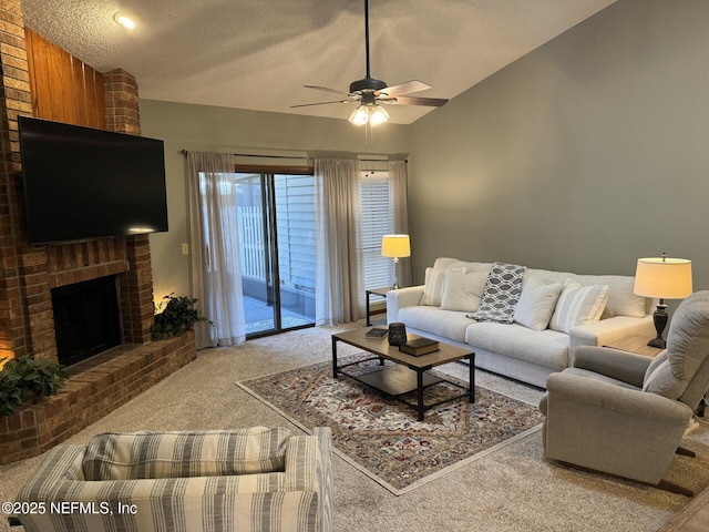 living room featuring lofted ceiling, a textured ceiling, a ceiling fan, a brick fireplace, and carpet