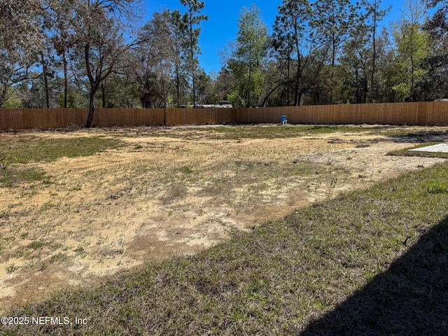 view of yard featuring fence