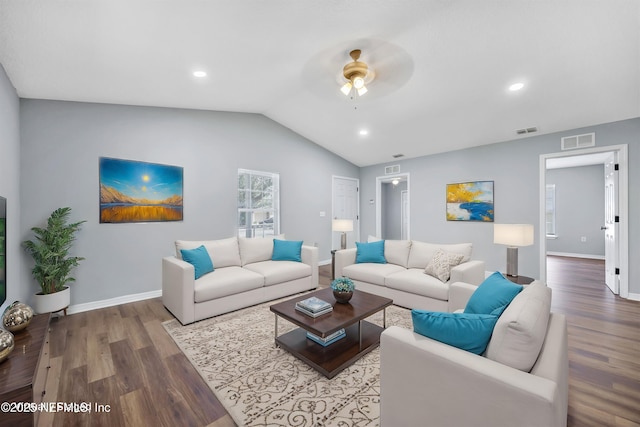 living area featuring lofted ceiling, wood finished floors, visible vents, and baseboards