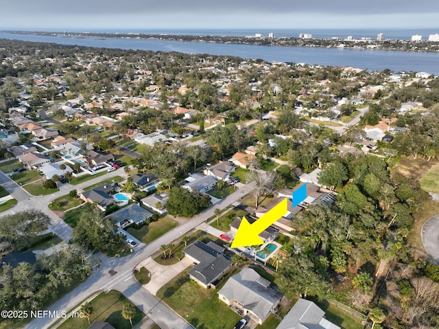 bird's eye view featuring a residential view and a water view