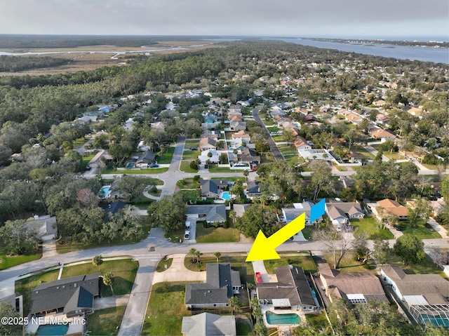 bird's eye view featuring a residential view and a water view