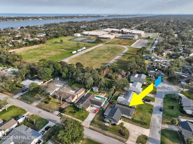 drone / aerial view with a residential view and a water view