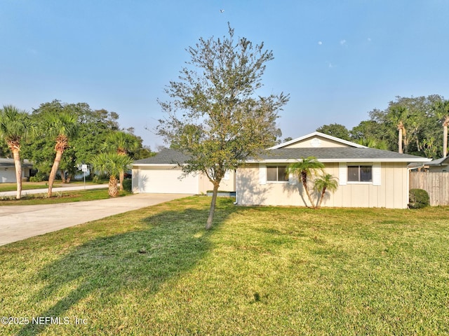 ranch-style home with a garage, concrete driveway, a front yard, and fence