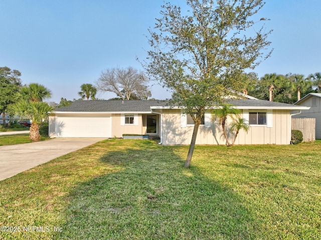 ranch-style house featuring a front lawn, concrete driveway, a garage, and board and batten siding