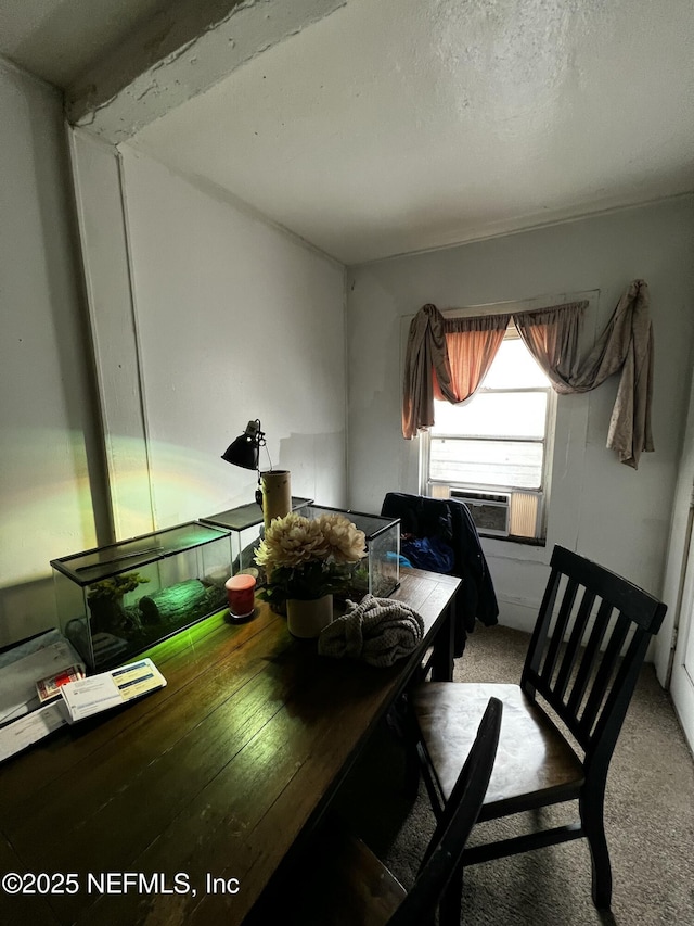 carpeted dining room with cooling unit