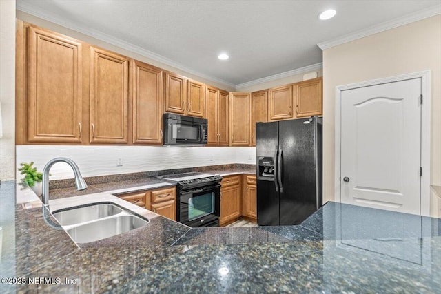 kitchen with crown molding, dark stone counters, a sink, and black appliances