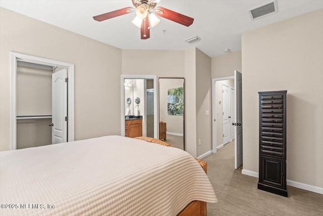 bedroom featuring baseboards, a ceiling fan, visible vents, and light colored carpet