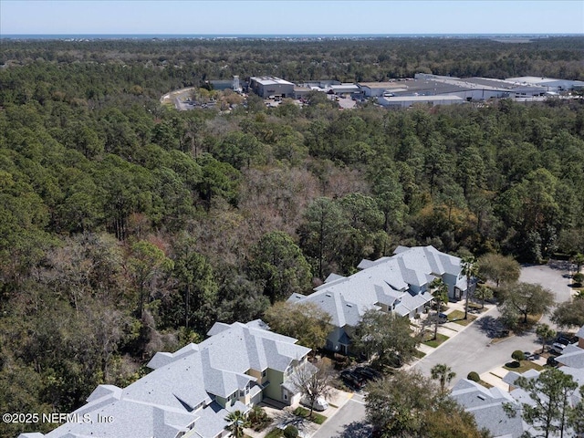 aerial view with a residential view and a wooded view