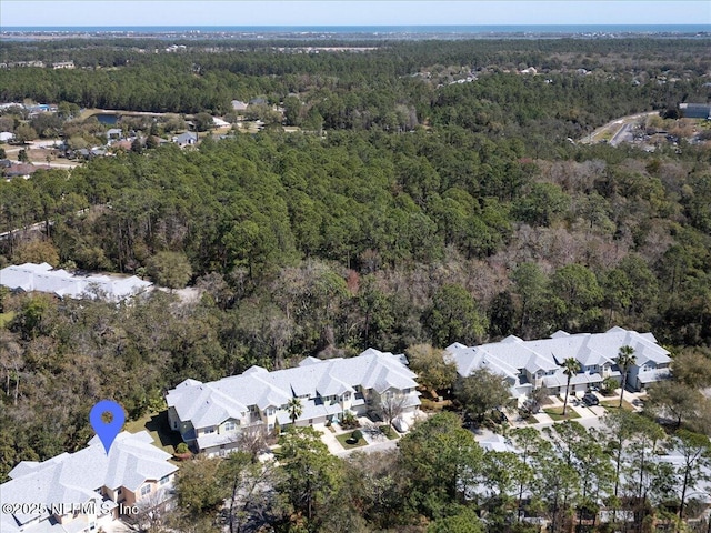 bird's eye view with a forest view and a residential view