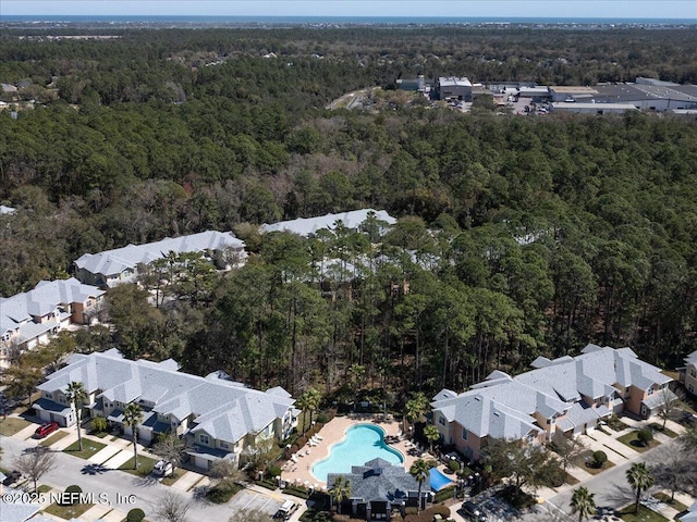 birds eye view of property featuring a residential view and a view of trees