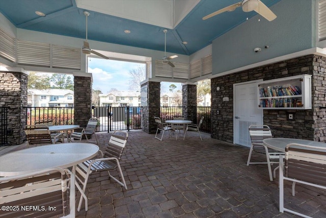 view of patio featuring outdoor dining area and a ceiling fan