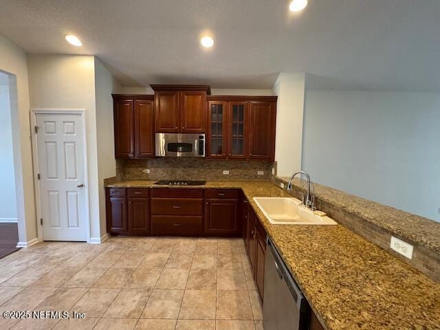 kitchen featuring recessed lighting, tasteful backsplash, appliances with stainless steel finishes, and a sink