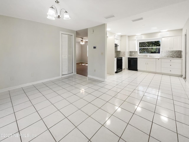 unfurnished living room with visible vents, ceiling fan with notable chandelier, a sink, light tile patterned flooring, and baseboards