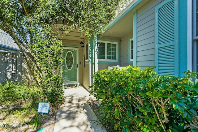 doorway to property with fence