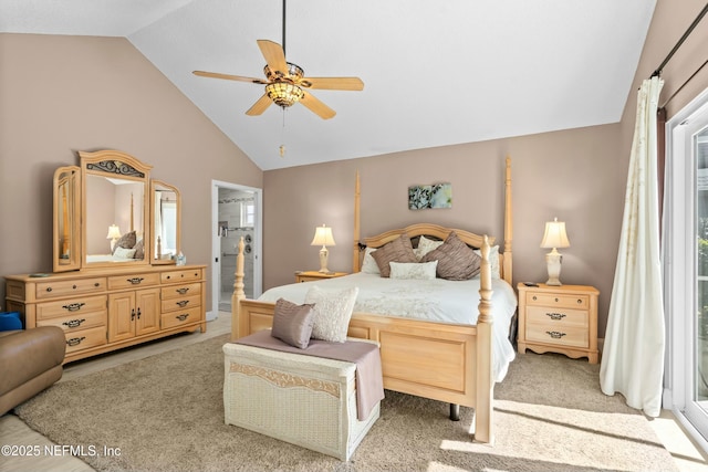 carpeted bedroom featuring lofted ceiling and a ceiling fan