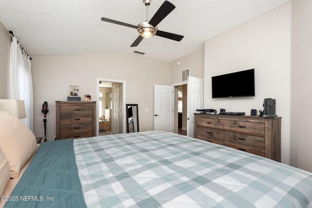 bedroom with visible vents, a textured ceiling, ceiling fan, and vaulted ceiling