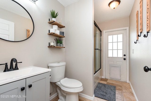 full bath with toilet, vanity, baseboards, and shower / bath combination with glass door