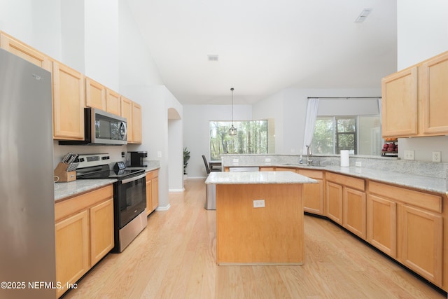 kitchen with light brown cabinetry and stainless steel appliances