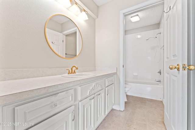 bathroom with a textured ceiling, toilet, vanity,  shower combination, and tile patterned floors