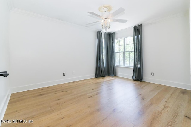 unfurnished room featuring a ceiling fan, crown molding, light wood-style flooring, and baseboards