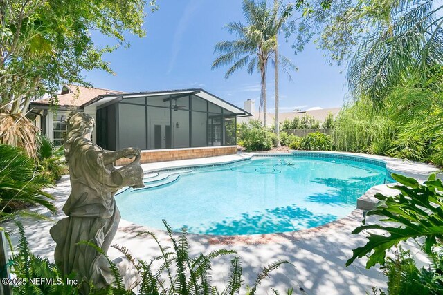 view of pool with a fenced in pool, french doors, fence, and a sunroom