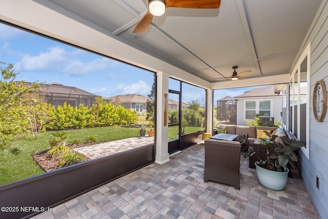 sunroom / solarium with ceiling fan