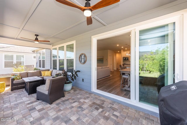 sunroom with ceiling fan