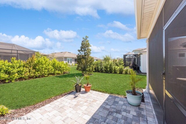 view of patio with a lanai